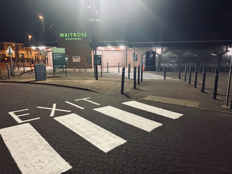 High-visibility directional markings in the Waitrose & Partners car park