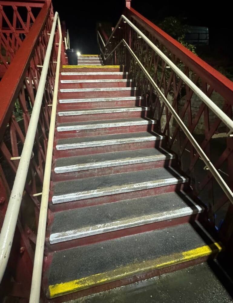 Repainted platform step edges at a Northumberland train station
