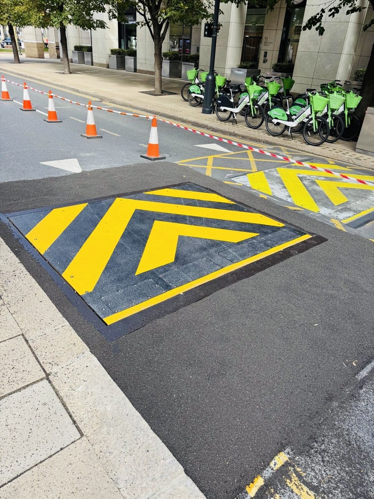 Yellow hatched markings around automatic road blockers