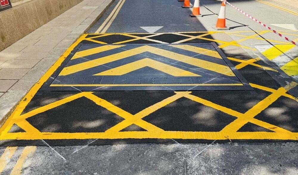 Anti-skid surfacing and yellow hatched markings at Canary Wharf